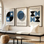 navy and black geometric bauhaus poster set in contemporary office workspace