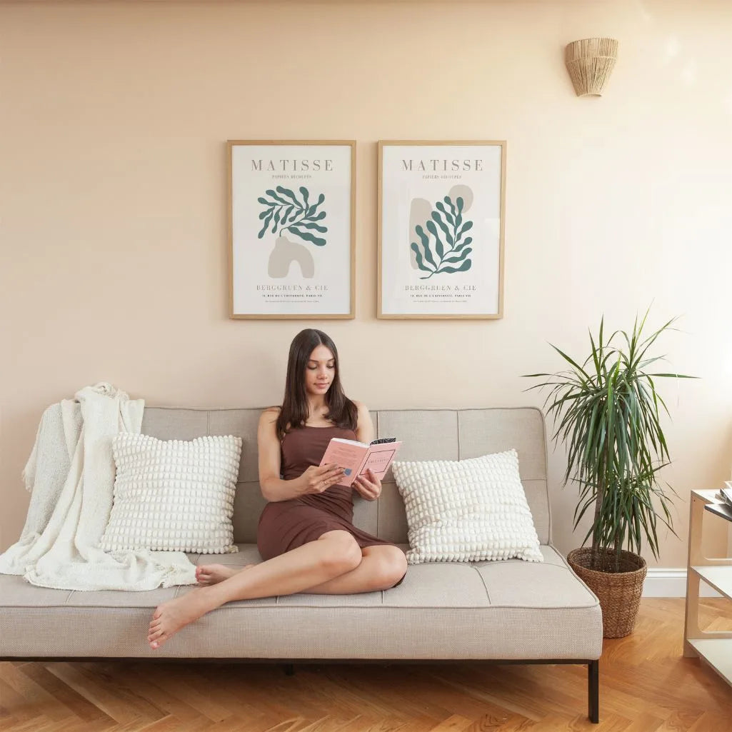 Set of 2 botanical form posters styled in bright living room with natural decor