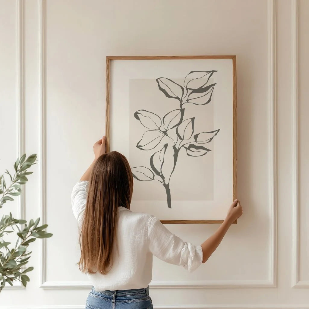 Minimalist branch line art poster displayed in gallery wall with neutral interior