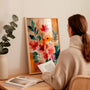Coral pink and orange botanical poster arranged for modern gallery wall decor in creative interiors