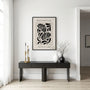 Graphic botanical poster styled in modern living room with neutral decor