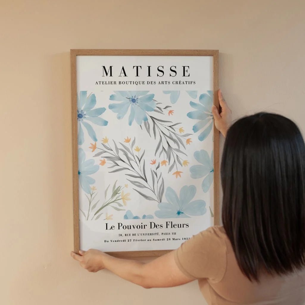 Matisse inspired blue flowers poster displayed in modern gallery wall arrangement
