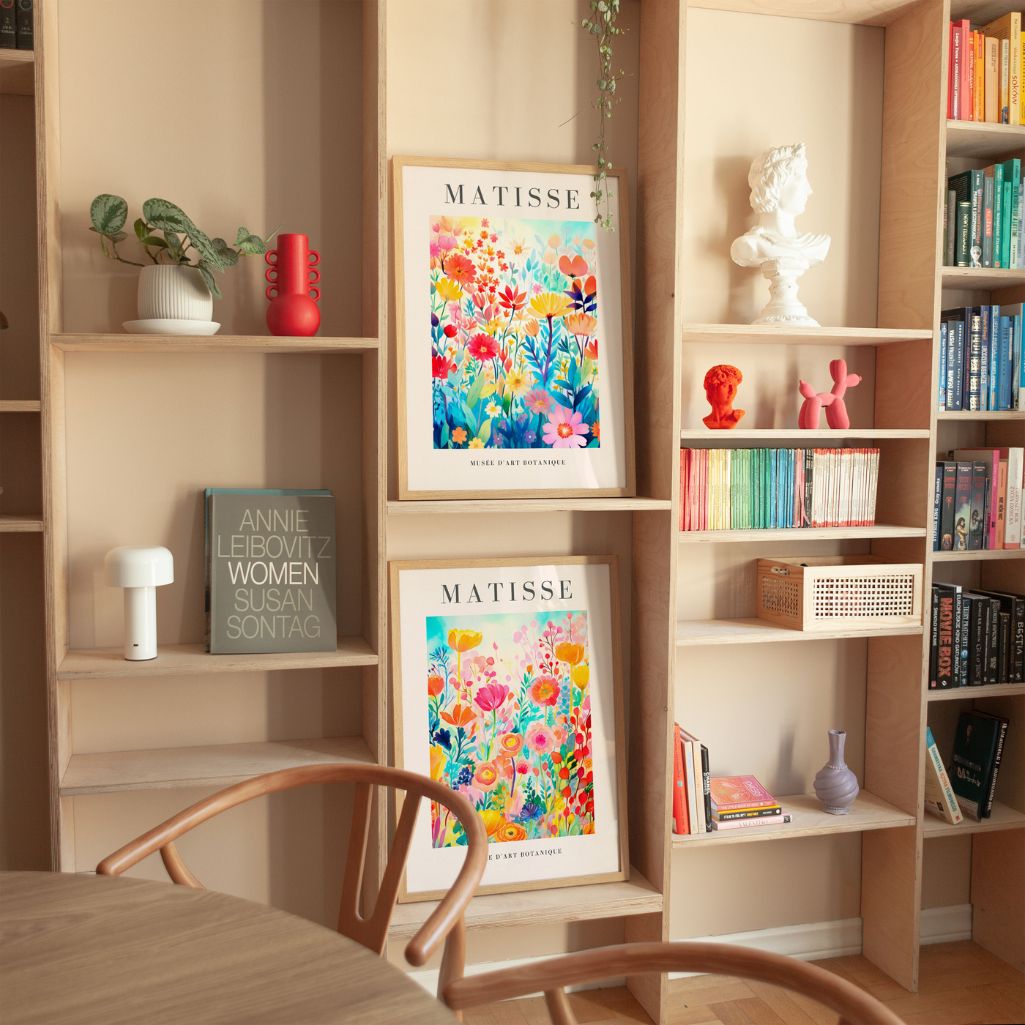 Set of 2 watercolor floral posters styled above sofa in modern living room gallery wall