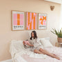 pink and orange geometric bauhaus poster set in creative office workspace